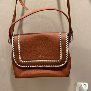 Rusted color with black and white trim Kate spade purse